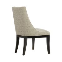 Rear view of a classic dining chair with curved back legs and back shaped to envelope your body.