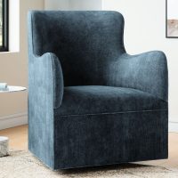 navy blue velvet swivel chair in a calming living room