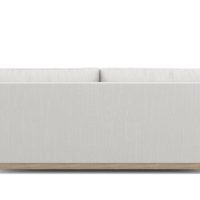 back view of white modern condo sofa with wood base