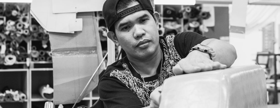 man working on custom upholstery in toronto