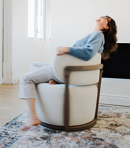 woman twirling in a custom swivel chair