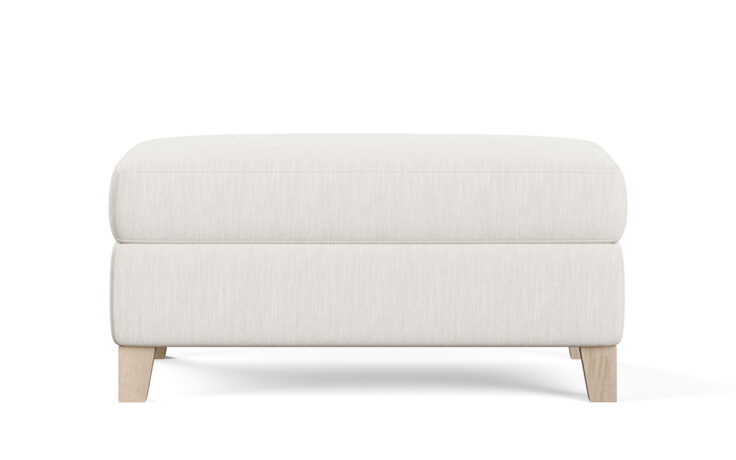 chelsea transitional ottoman in a white fabric with light wood legs